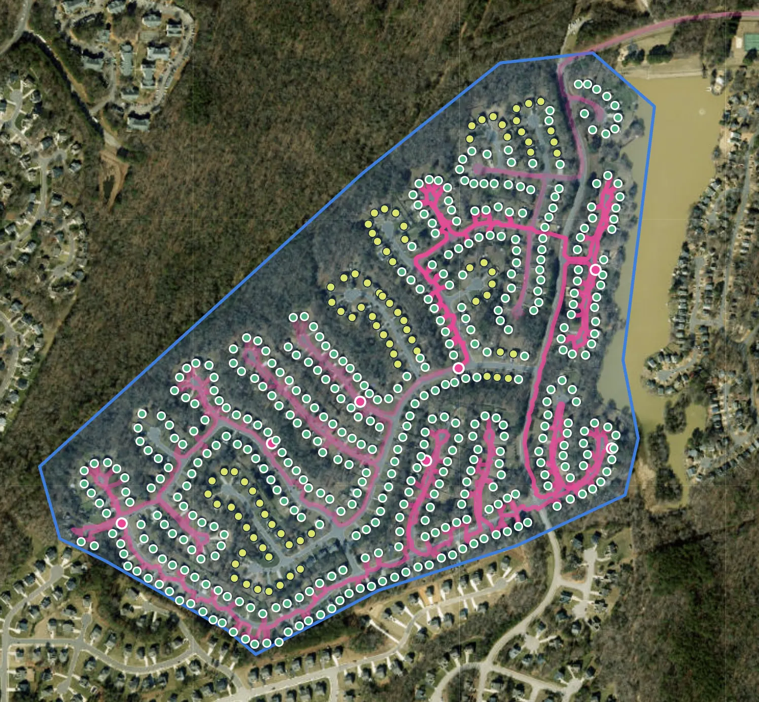 FlyerFly satellite map of a finished door hanger route: the worker's GPS path in pink, green dots on the homes they reached and yellow dots on the homes still to do